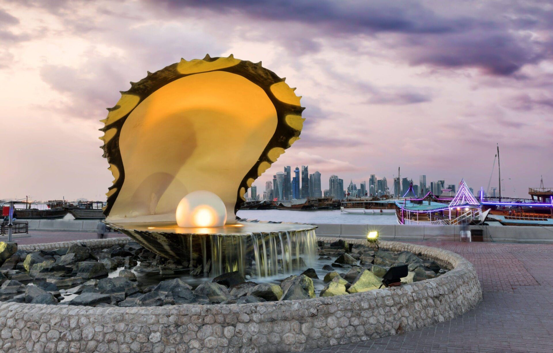 Pearl Fountain and Skyline of Doha, Qatar During Sunset